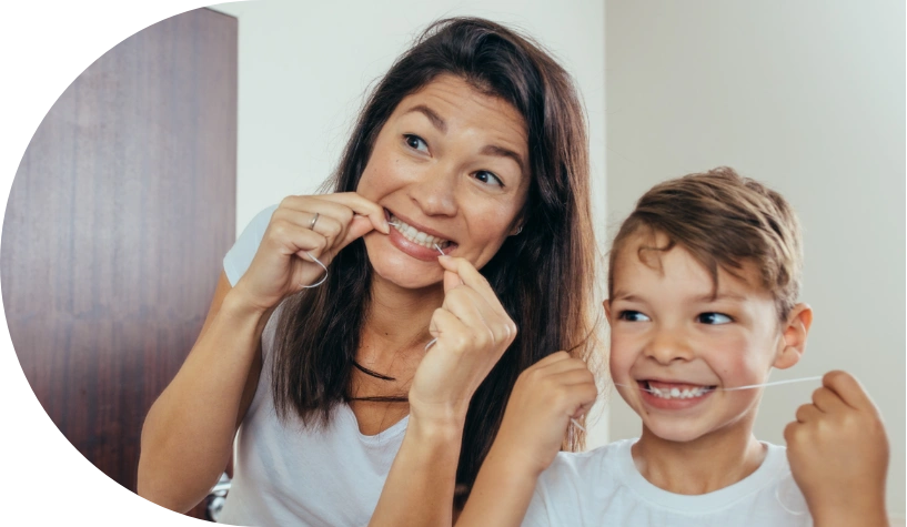 mother and son flossing